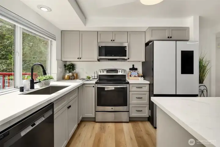 Beautiful kitchen with eat at island will make cooking fun