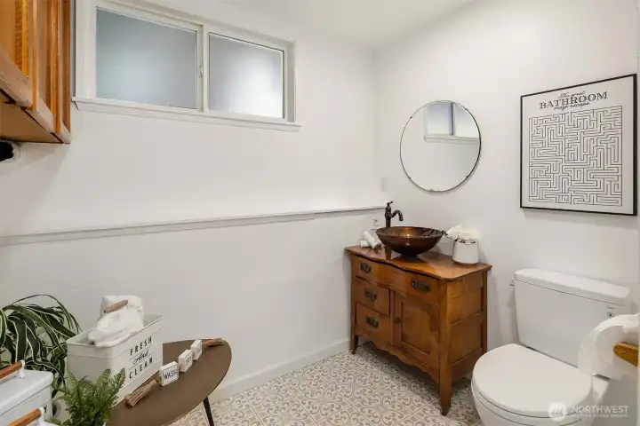 Lower level utility room with half bath