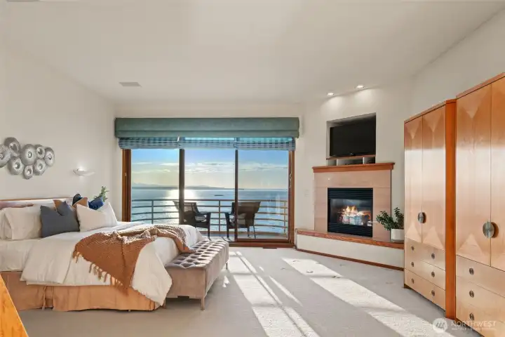 Primary suite with fireplace and private deck.