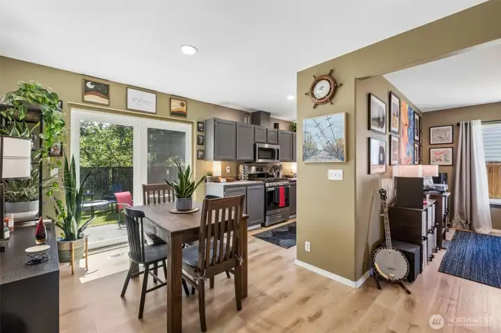 Light-filled dining area with sliding glass doors that create an easy connection to the backyard and outdoor living space. Light-filled dining area with sliding glass doors that create an easy connection to the backyard and outdoor living space.