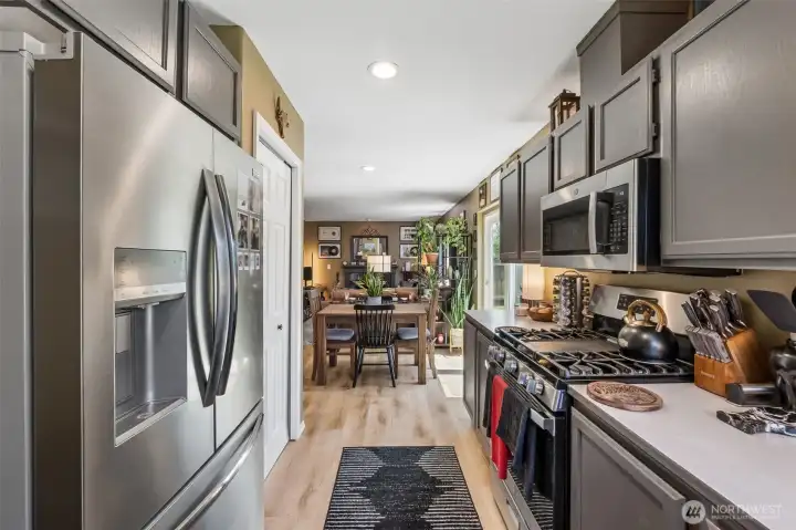 Well-appointed kitchen featuring updated appliances, generous counter space, and abundant storage. Well-appointed kitchen featuring updated appliances, generous counter space, and abundant storage.