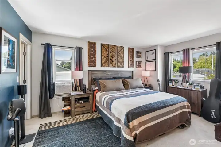 Bright primary suite featuring abundant natural light, large closet, and private ensuite bathroom. Bright primary suite featuring abundant natural light, large closet, and private ensuite bathroom.