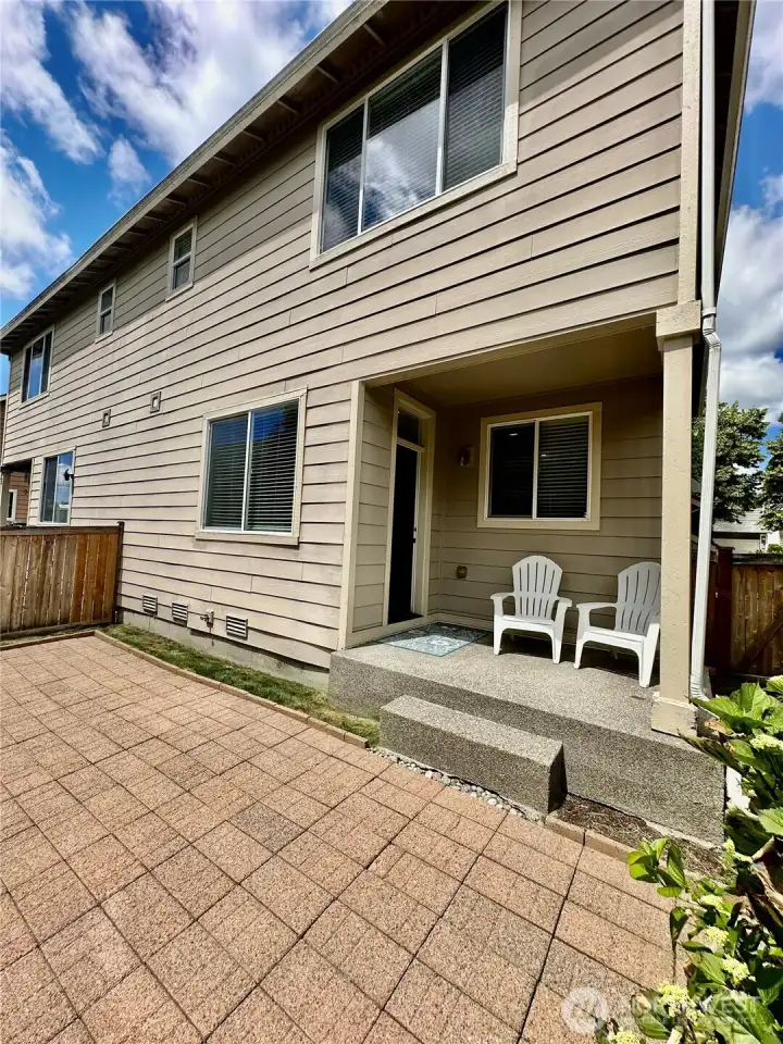 View of the covered and un-covered patio with garden beds...completely fenced for privacy. View of the covered and un-covered patio with garden beds...completely fenced for privacy.
