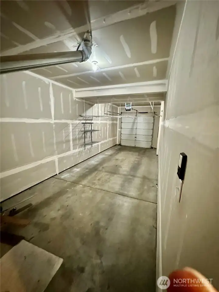 Attached tandem garage with electric door opener. Attached tandem garage with electric door opener.