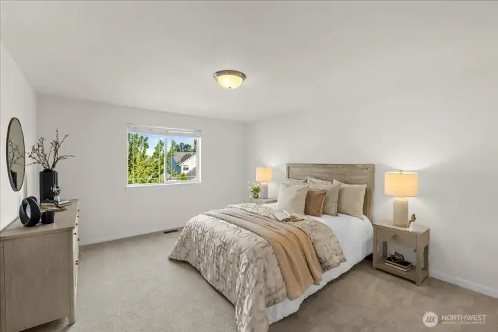 The generous primary bedroom is a quiet retreat