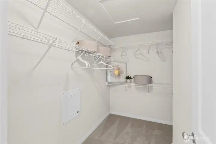 Primary bedroom walk-in closet