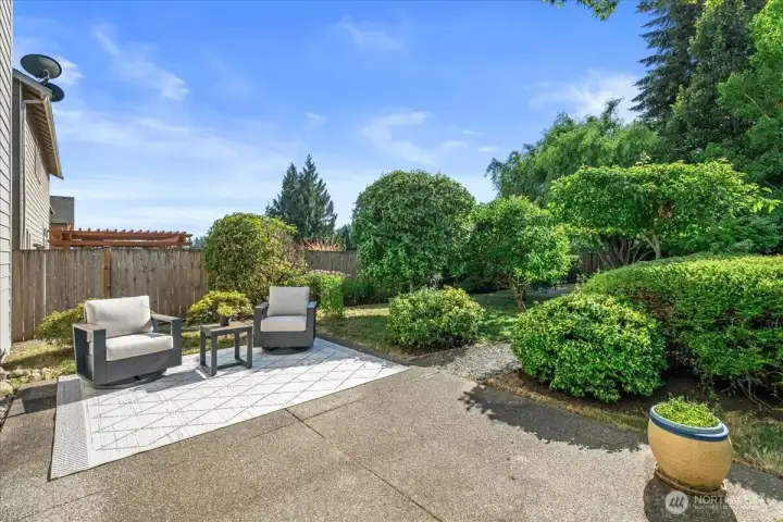 Relax on the patio in your the park-like backyard with mature landscaping