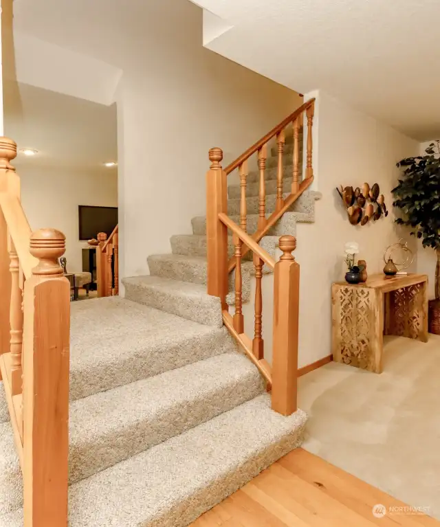Stairs at entry that lead to living room & upstairs