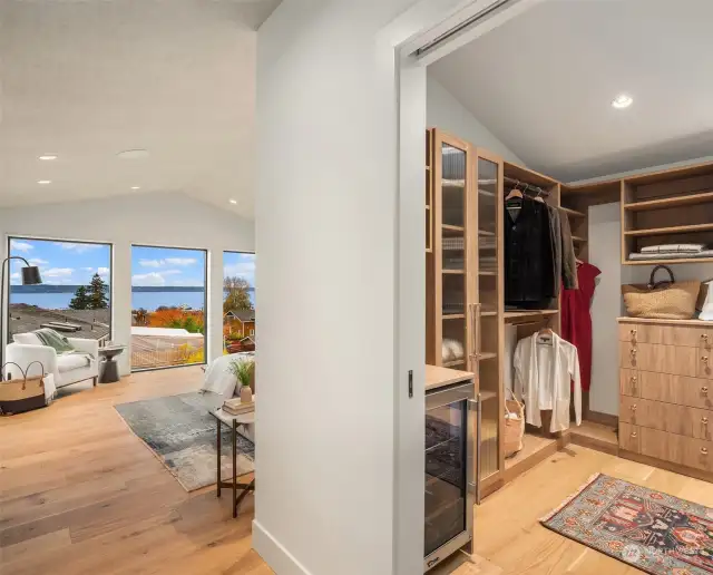 Primary bedroom closet with beverage station.