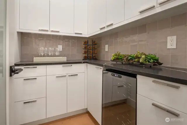 Full pantry with ample storage plus wine fridge