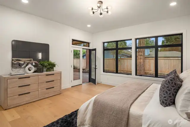 Generous primary suite w/ french doors to patio