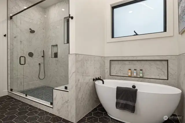 Private soaking tub and huge walk in shower with rain showerhead