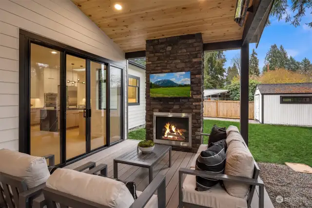 Covered patio living with gas fireplace, heaters, speakers & TV