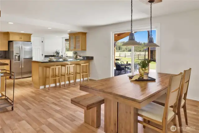 The dining room is adjacent to the kitchen and has access to the covered back patio