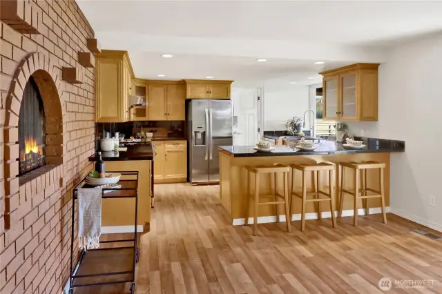 A great country kitchen complete with a wood-burning fireplace. Maybe a future pizza oven?