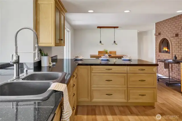 The large kitchen sink overlooks the yard and has abundant counterspace for plants