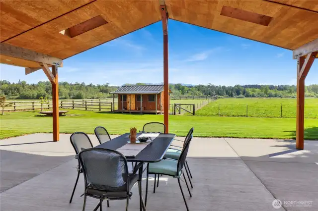 The covered back patio is a showstopper with so much room for relaxing and enjoying the view