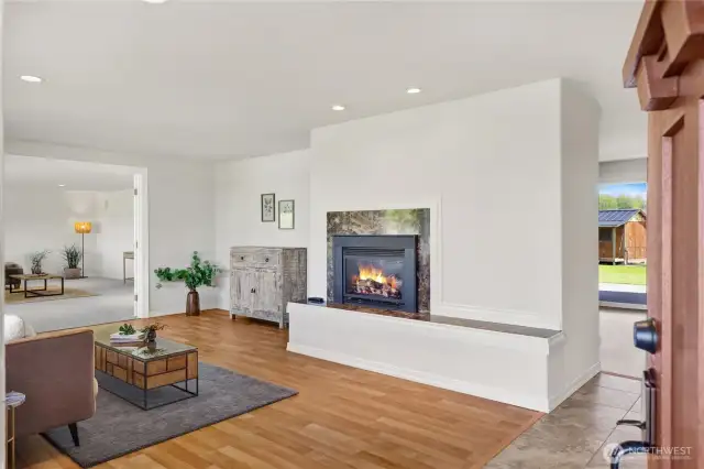 Be greeted with a spacious entry way that flows to a living room complete with cozy gas fireplace