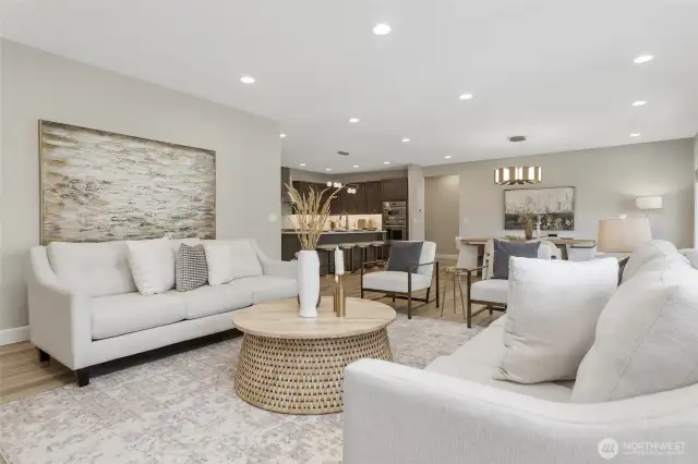 The luxury vinyl plank flooring flows seamlessly throughout the home, providing a touch of modern elegance and a sense of continuity between the spaces.  The dimmable recessed lighting allows you to adjust the ambiance.