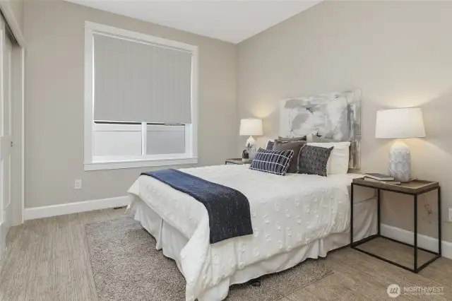 The two generously sized bedrooms, currently showcasing queen beds, offer the flexibility to easily accommodate king-size beds or even two full-size beds in one room.