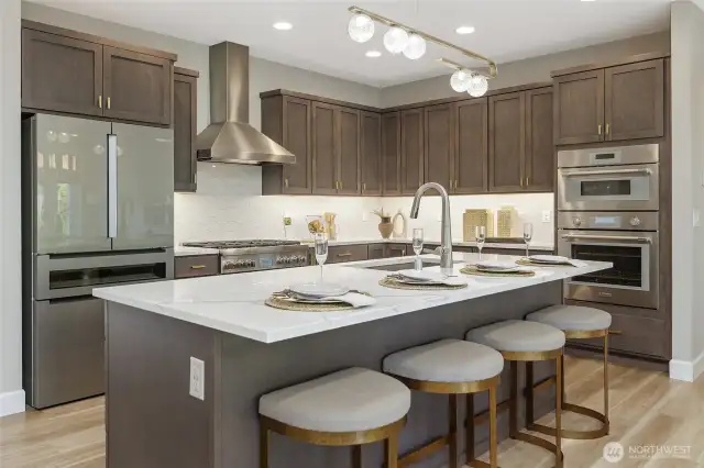 Designed for seamless entertaining, the open layout flows effortlessly around the central kitchen island, creating a natural hub for guests to engage with the host.