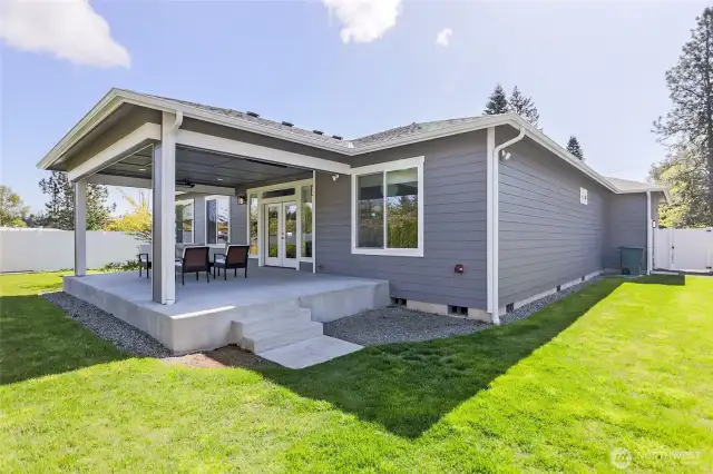 Professionally landscaped, the expansive 9,750 square foot lot features a private fenced backyard perfect for relaxation and outdoor enjoyment.