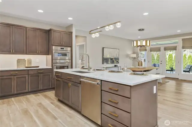 Designed for seamless entertaining, the open layout flows effortlessly around the central kitchen island creating a natural hub for guests to engage with the host.