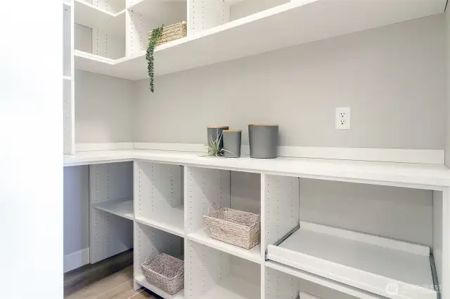 Enjoy the efficiency of a walk-in pantry, thoughtfully designed and installed by California Closets, providing storage you'll truly appreciate.
