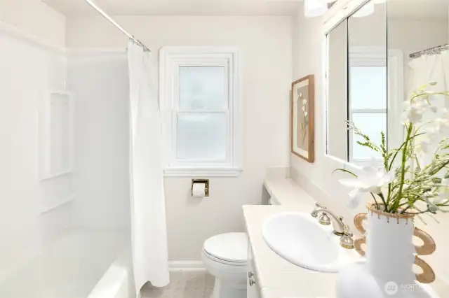 Fresh updates (brand new shower surround) and thoughtful details make this space feel both current and comforting.