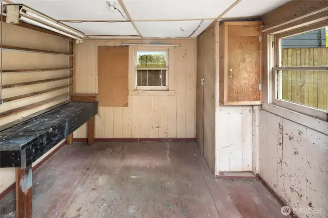 The ultimate project zone, attached to the detached garage—gardening shed, art studio, or secret hangout spot.