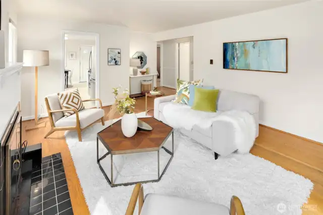 Original hardwoods ground the living space with charm and character, complementing the home’s vintage roots.