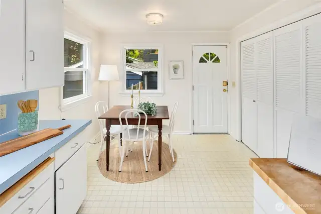With windows on two sides and direct access to the backyard, this dining space is a cheerful extension of the kitchen.