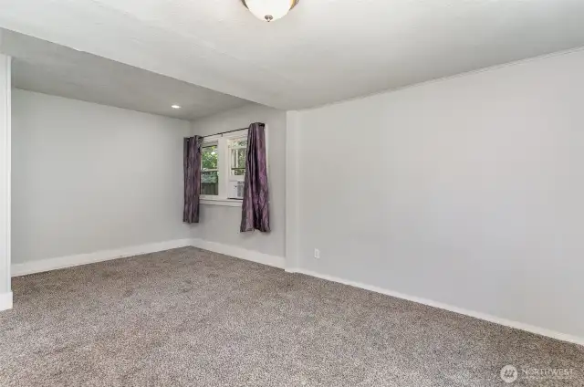 Spacious primary bedroom offers a large closet and a versatile nook—perfect for a reading corner, vanity, or small workspace.