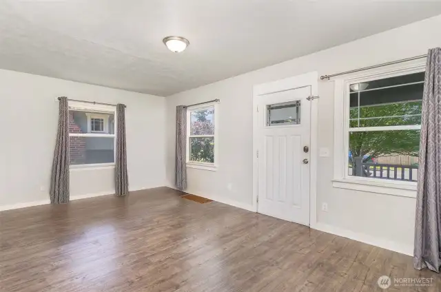 Another angle of the living room highlights its generous size, inviting atmosphere, and seamless flow into the rest of the home.