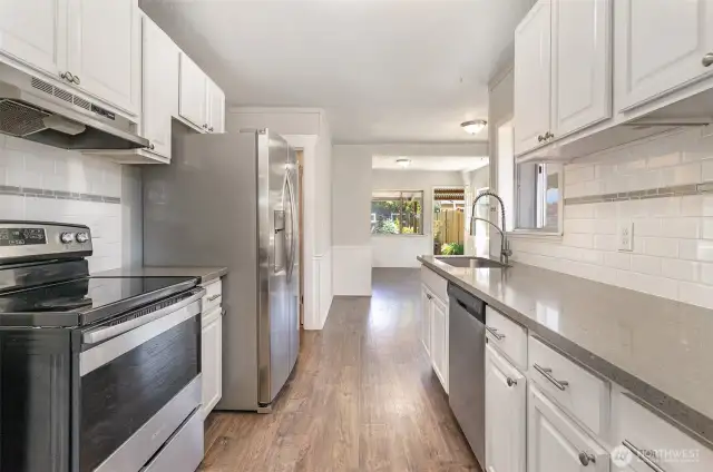 Galley style kitchen centered in the middle of the home.