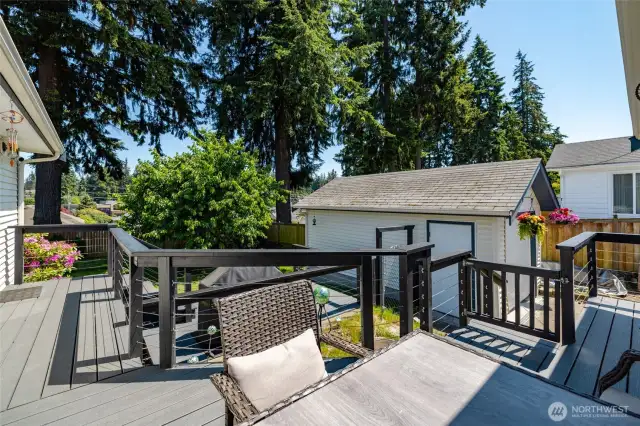 Composite decks have 2 sliders leading outside. Nice sized garage has many uses...