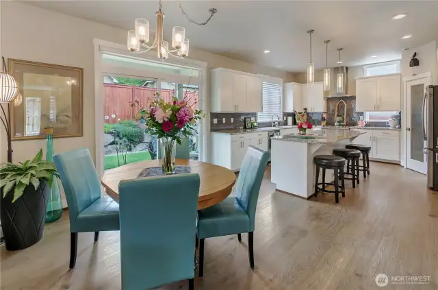 Gourmet kitchen flows seamlessly into nook area and Great Room with large slider to bring the outside in or the inside out!