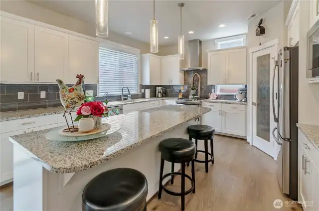 Walk=in pantry, great storage and comfortable seating for 3+ at island helps make this the perfect space for entertaining and preparing meals.