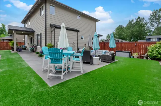 Covered and uncovered outdoor entertainment areas! Large paver patio with seamlessly connects to poured concrete patio undercover with artificial turf making this a low maintenance extension of your inside living space.