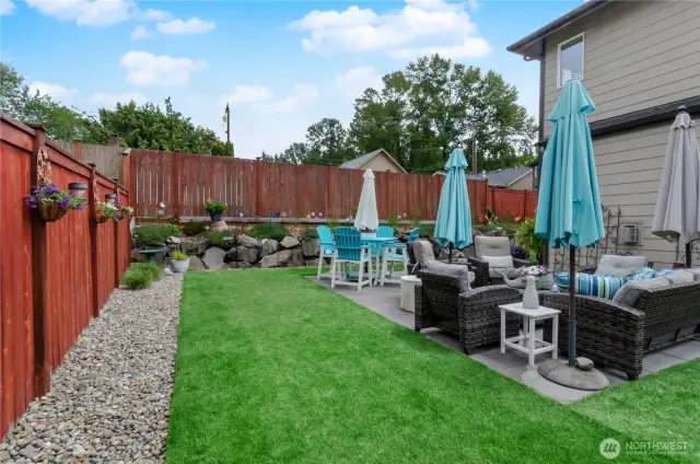 Plenty of "grass" area around extended patio to play games, walk barefoot or play corn-hole!