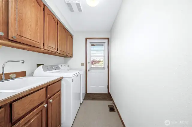 Large laundry room with plenty of storage space.