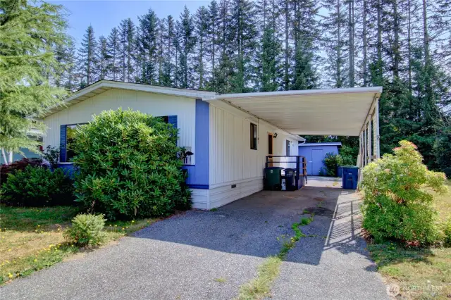 Front view of home with covered car port