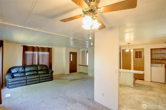 View from dining area towards living room, front door and kitchen
