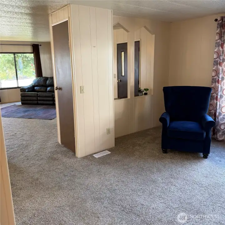 view of family room, closet and sitting areas