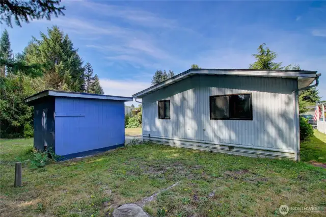 view looking from backyard towards the shed and home