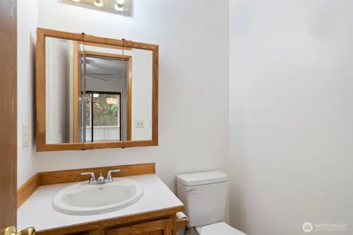 Downstairs half bath off of family room