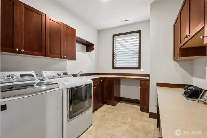 Laundry Room with more cabinets and storage and bonus office space!