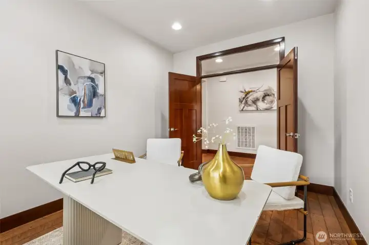 French doors with the window above brings extra light into this space.