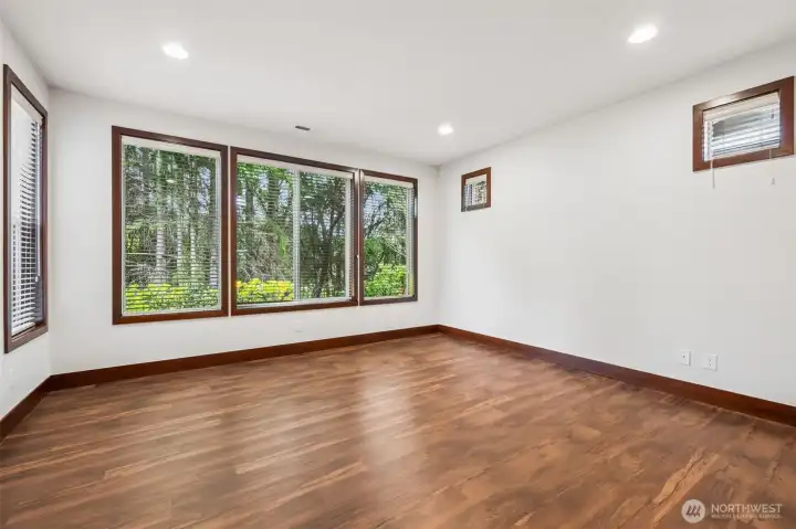 Really large primary bedroom located on the back side of the home facing the golf course just beyond the trees. So quiet in the evenings, it's like you're out in the country.