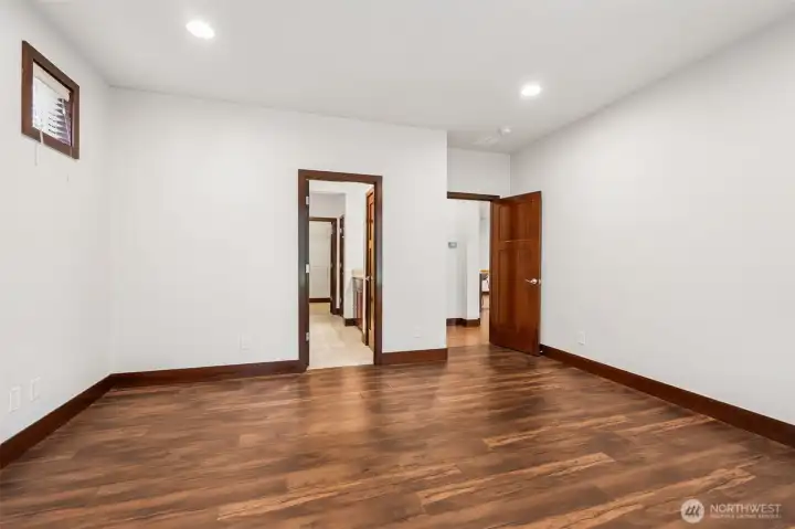 The space in this room is larger than expected, smaller windows on this wall to continue bringing in all the light, and the en-suite is perfectly located just alongside you. Wait till you see inside.